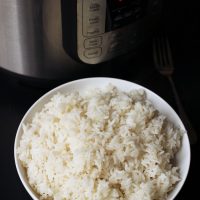 bowl of rice next to instant pot