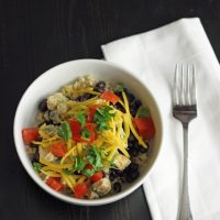 Cilantro Chicken Rice bowl with fork and napkin