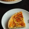 A slice of Quiche on a plate