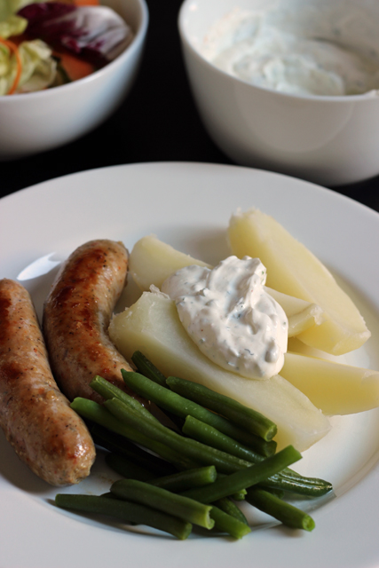 Sausage and Potatoes with Sour Cream Sauce on a plate