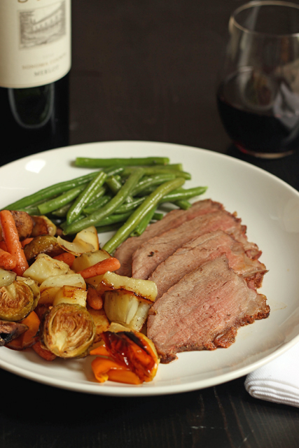 Spicy Grilled Tri-tip on a plate with roasted veggies