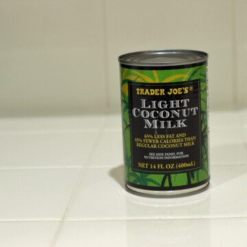 A can of coconut milk on a counter