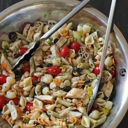 A bowl of pasta salad with chicken