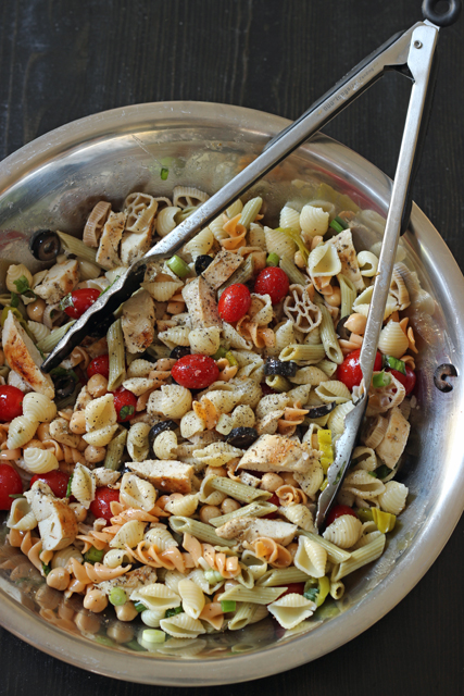 A bowl of pasta salad with chicken