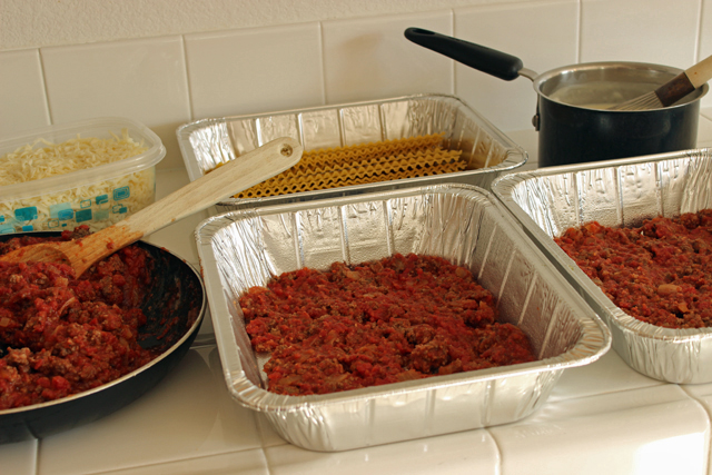 containers prepped with lasagna ingredients for freezing