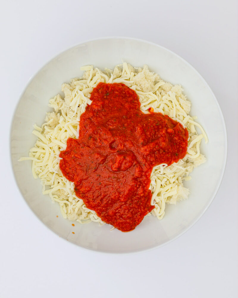 bread crumbs in bowl with cheese and marinara.