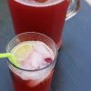 A cup of cherry Limeade, with pitcher