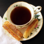 puffs on saucer with cup of tea