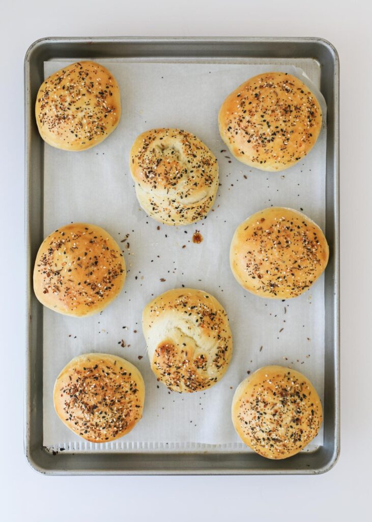 baked buns on sheet.
