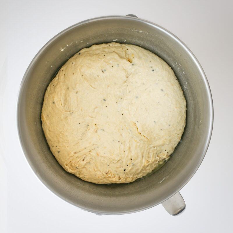 the risen dough in the mixing bowl.