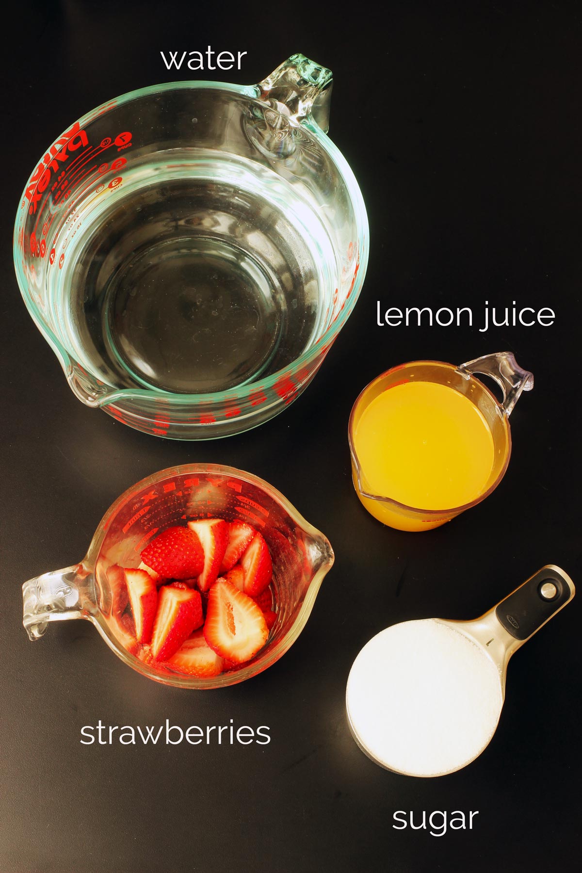 ingredients needed to make pink lemonade: strawberries, lemon juice, sugar, and water