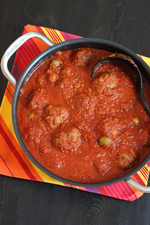 Pot of boules de picolat with ladle