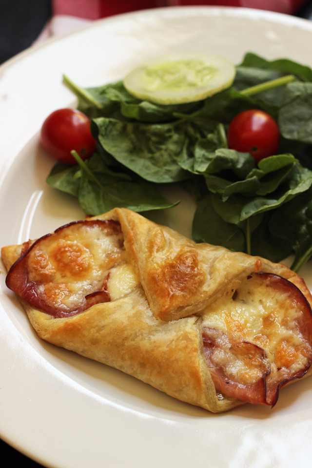 ham and cheese fold-over on plate with salad