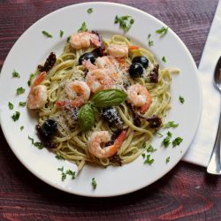 A plate of linguine and shrimp