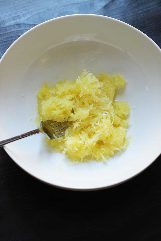 spaghetti squash "noodles" in a bowl with a fork