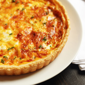 A close up of a Quiche on a plate