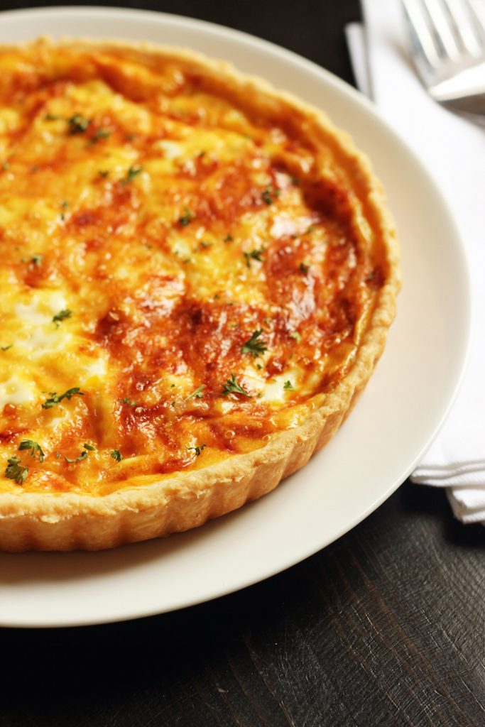 A close up of a Quiche on a plate