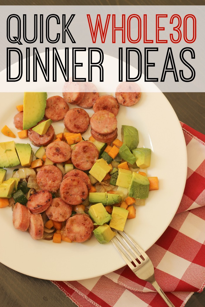 A plate of sausage and potatoes with avocado