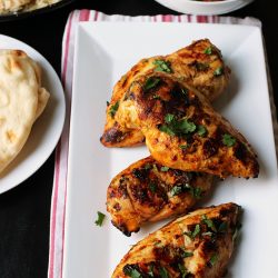 buffet set with grilled chicken and side dishes