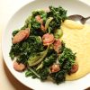 A plate of sausage and greens, with Polenta