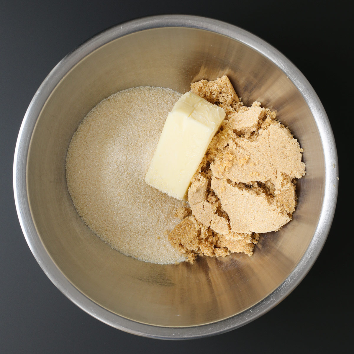 butter and sugars in mixing bowl.