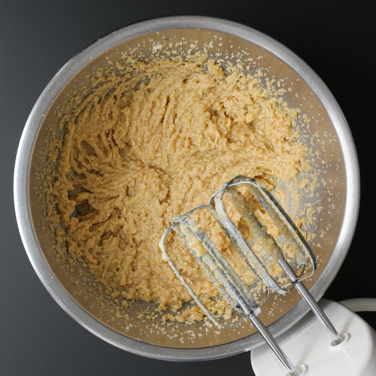 butter sugar mixture in bowl with beaters.