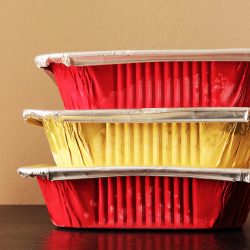 gold and yellow freezer meals stacked on table