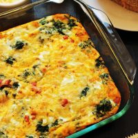 egg bake on breakfast table with toast and butter