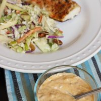 A bowl of Remoulade next to fish plate