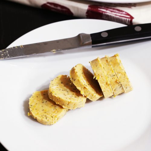 roll of herbed butter cut into slices