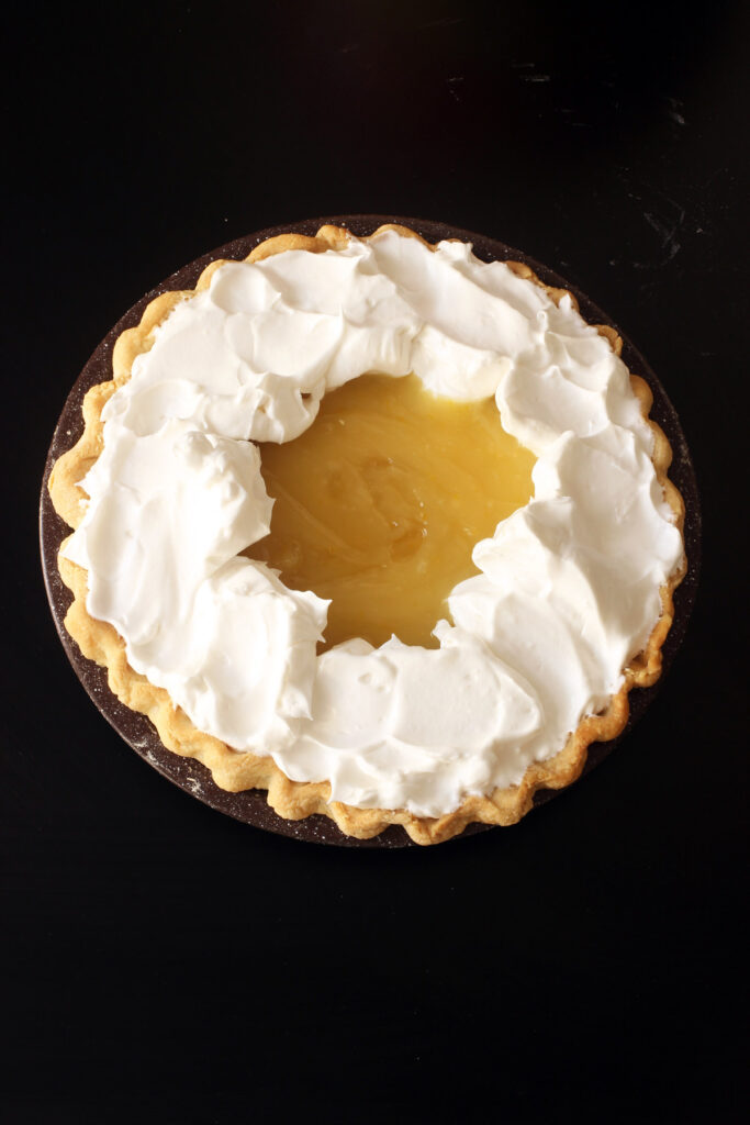 adding meringue to pie