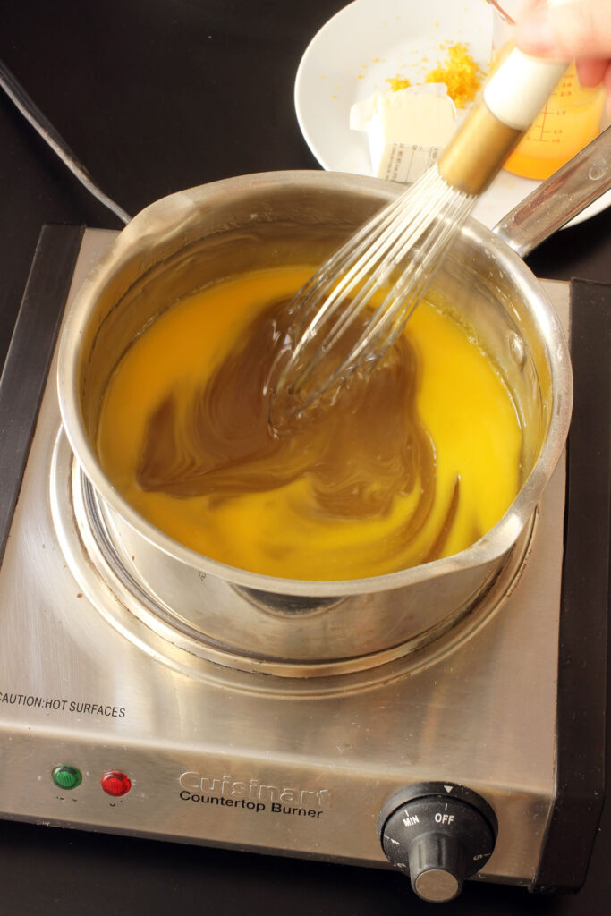 mixing yolks into filling in pot