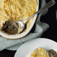 serving shepherd's pie onto plate