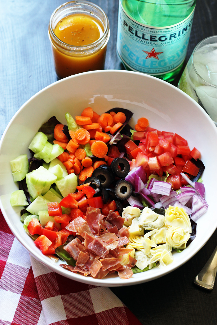 A bowl of Italian salad with crispy prosciutto