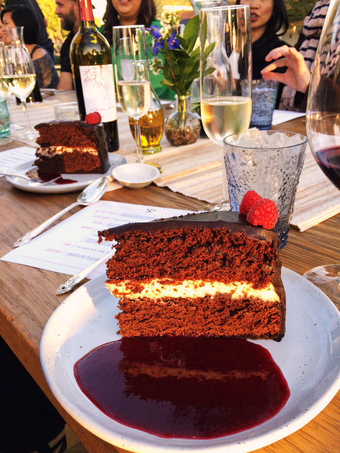 A piece of chocolate cake on a party table