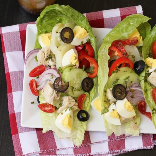 niçoise lettuce wraps on white plate
