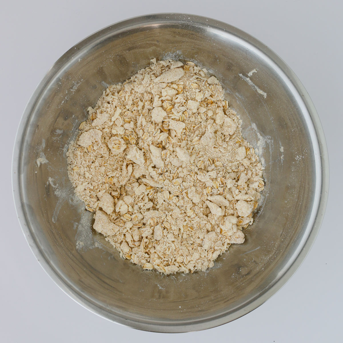 assembled crumble topping mixture in mixing bowl.