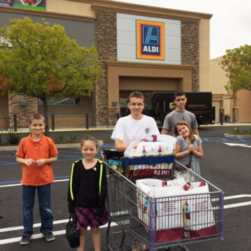 A group of kids in front of Aldi