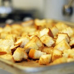 A close up of croutons on tray