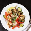 A plate of shrimp and vegetables