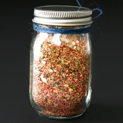 jar of taco spice mix with blue bakers twine around the neck.