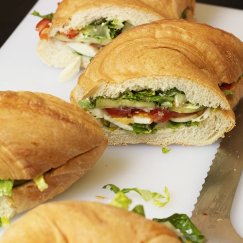 Large picnic sandwich cut into portions