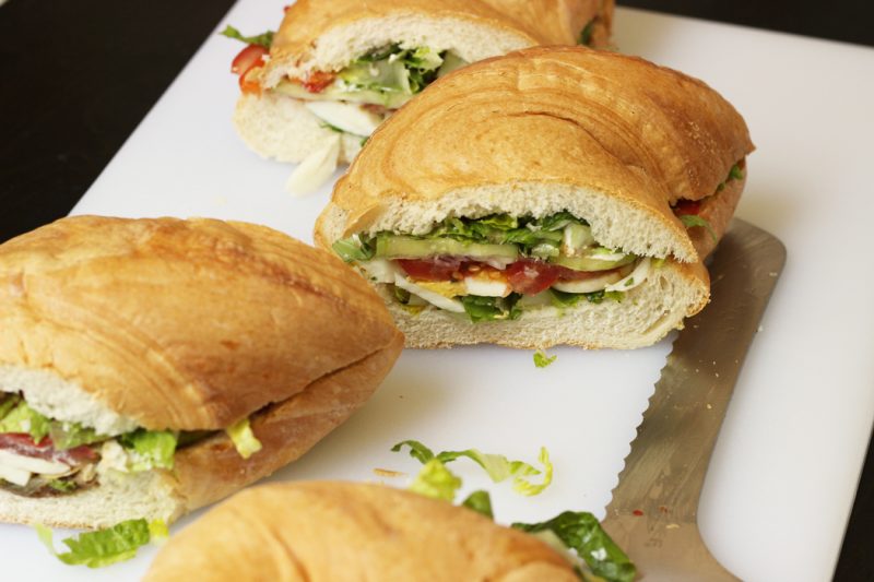 Large picnic sandwich cut into portions