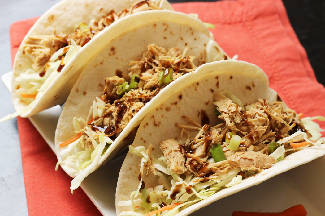 Moo Shu Chicken in tortillas on plate