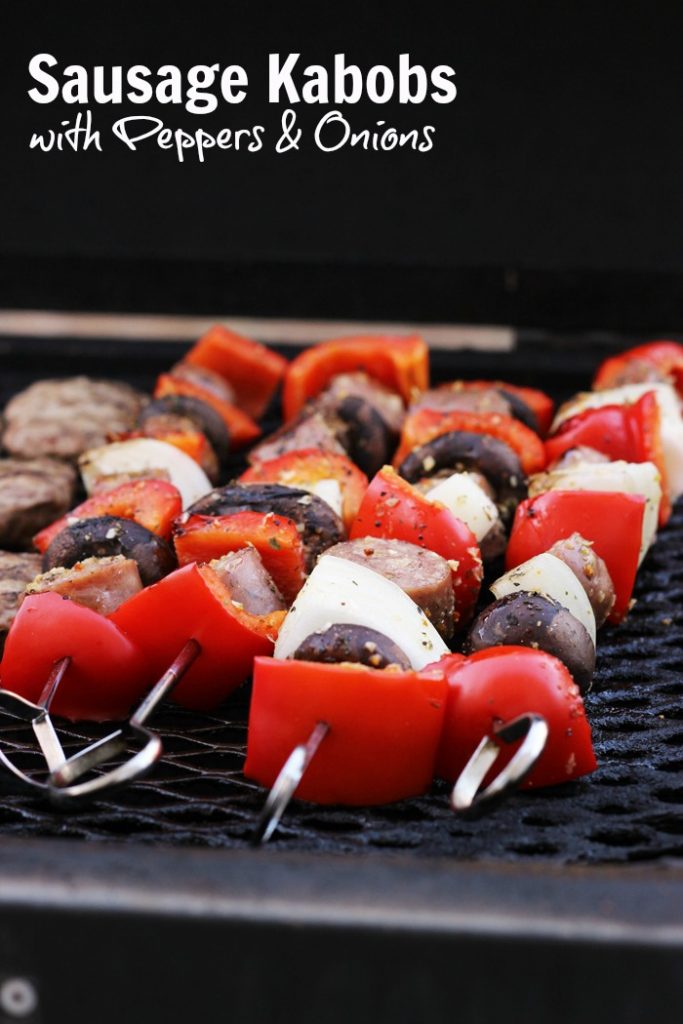 A close up of sausage kabobs on grill