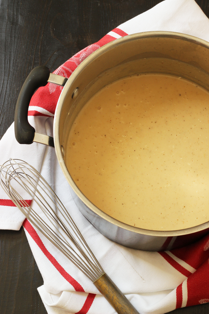 whisk next to pot of cream of chicken soup