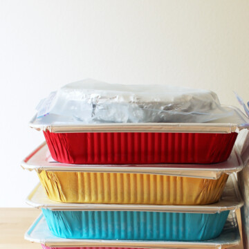 stack of freezer meals in colored baking pans