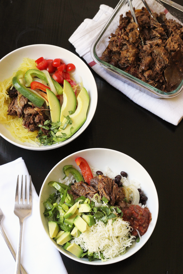 Bowls filled with Barbacoa Beef and toppings