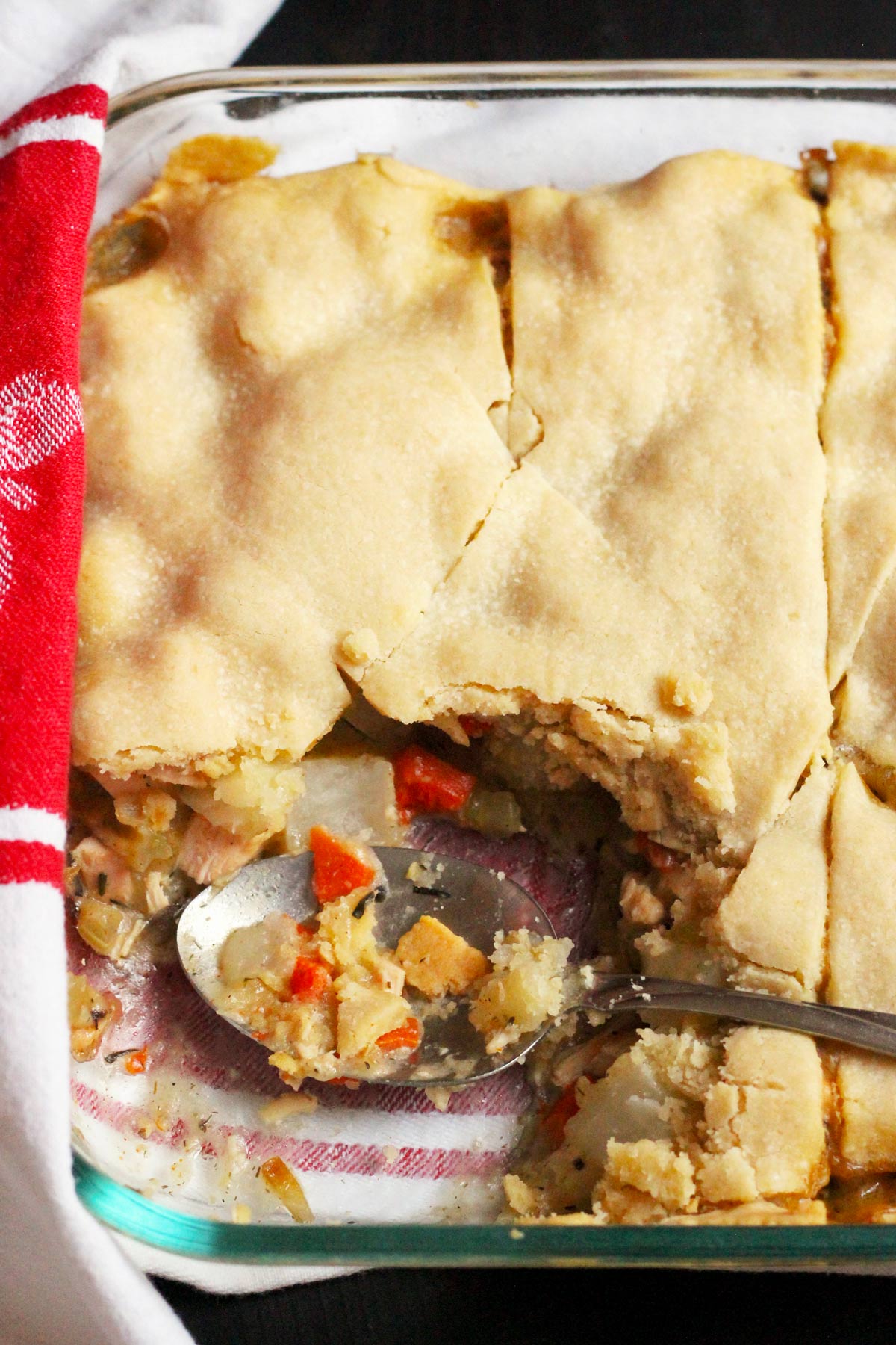 pot pie on towel with serving spoon
