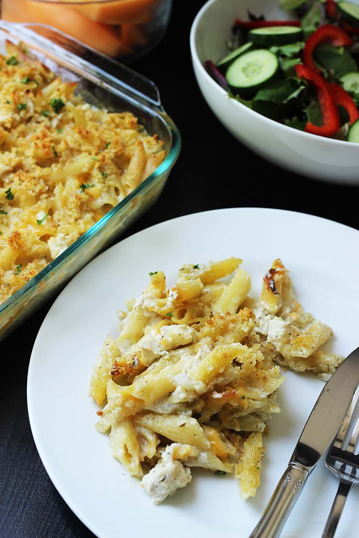 casserole dished onto plate near serving dishes